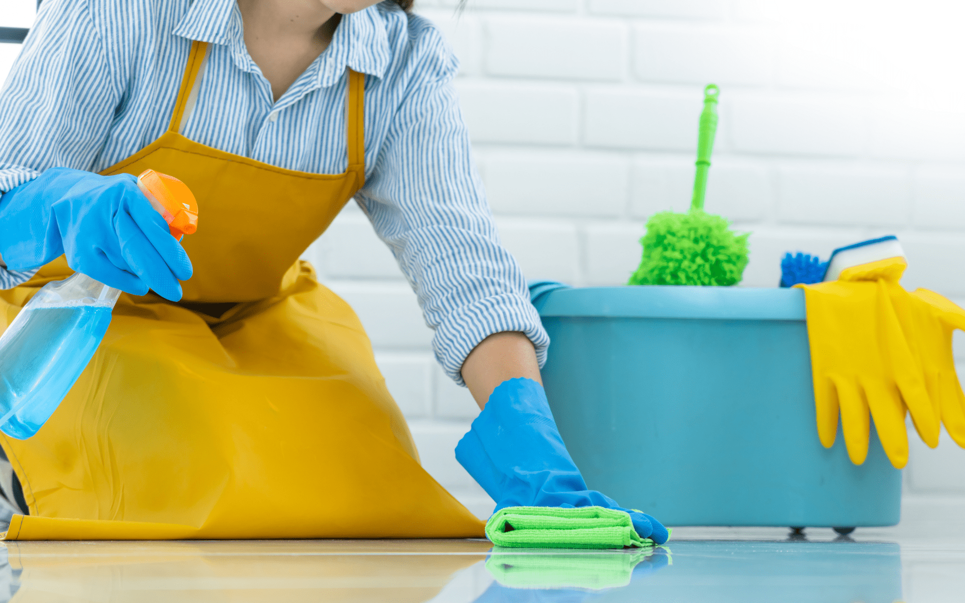 Deep floor cleaning using disinfectant spray and microfiber cloth by professional cleaning staff.